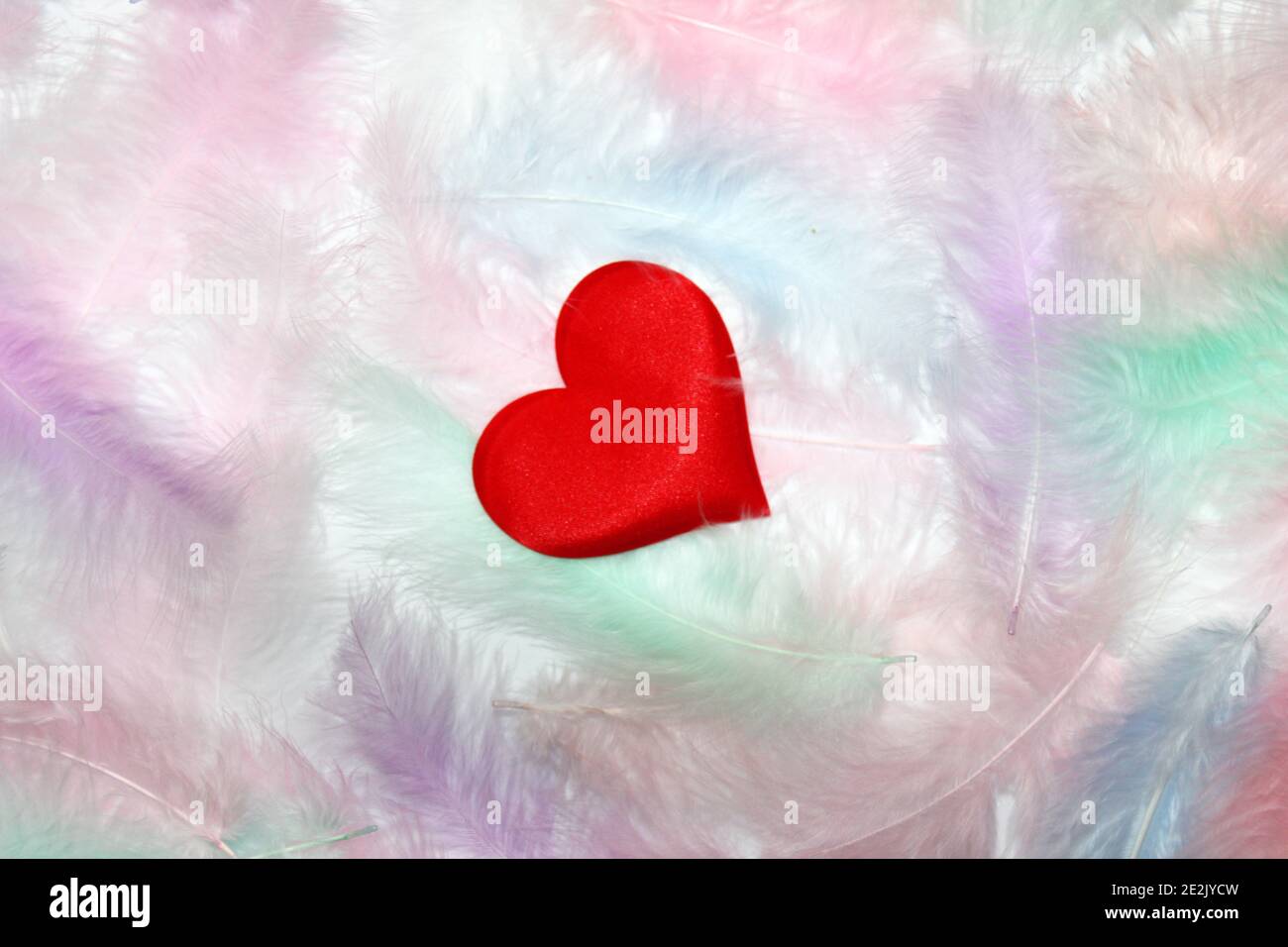 Flying red hearts on white background. Valentine's Day. Symbol of love. Copy space. Stock Photo
