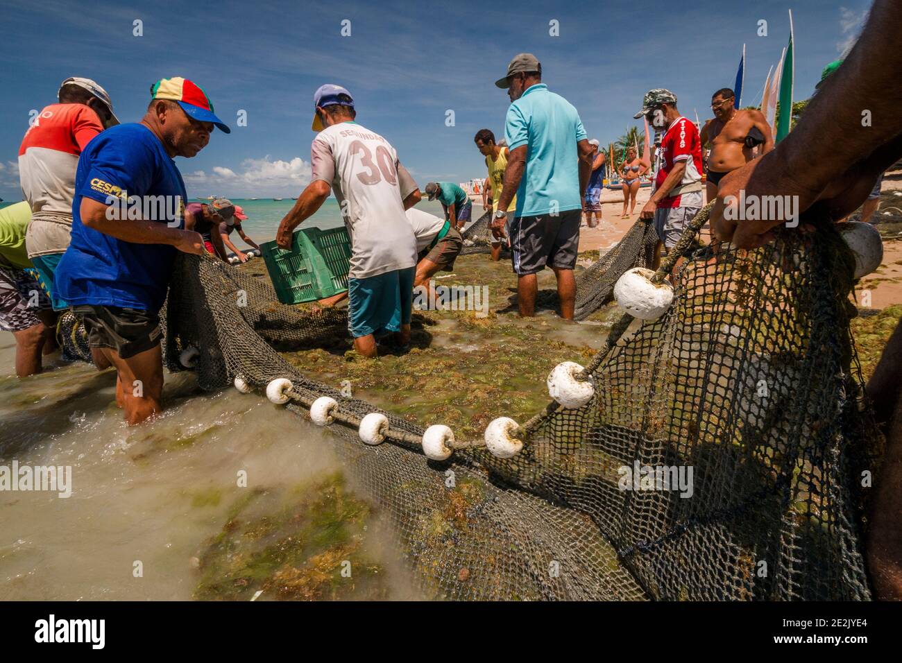 Fishermen working on a beach in Maceió, Brazil Stock Photo