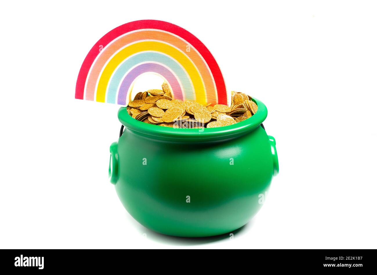 Green Pot Full of Golden Coins at the End of the Rainbow Stock Photo