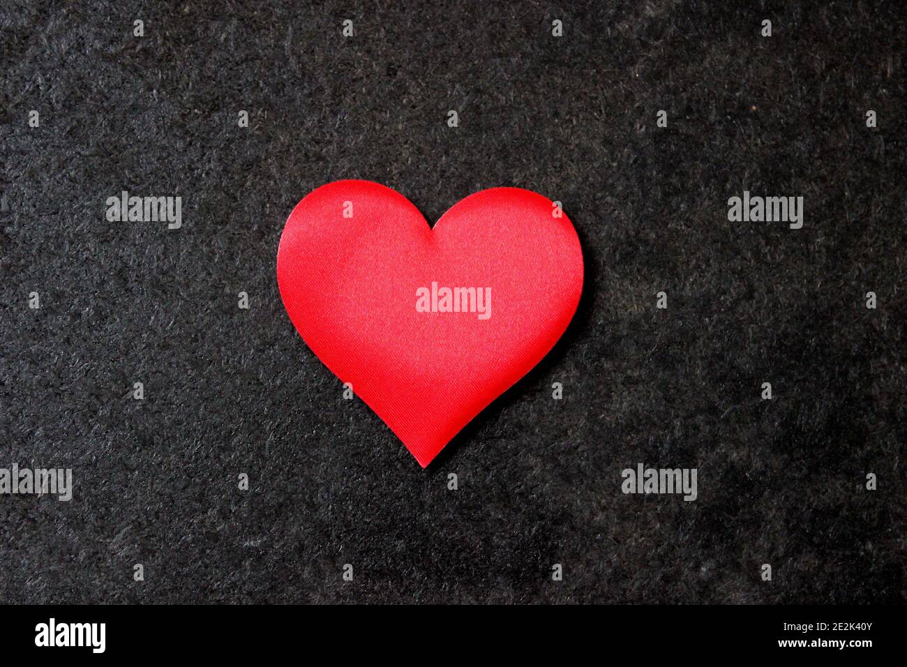 St. Valentine day background. Red heart on dark background Stock Photo ...