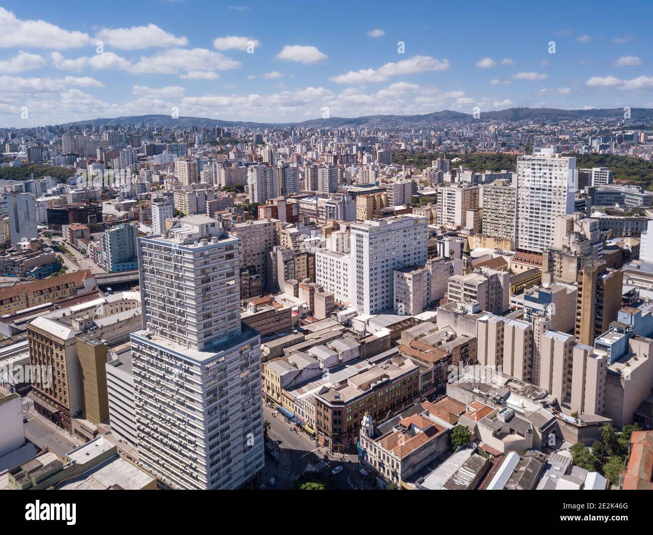 Drone aerial view of buildings skyline of Porto Alegre city, Rio Grande do Sul state, Brazil. Beautiful sunny summer day with blue sky. Concept of urb Stock Photo