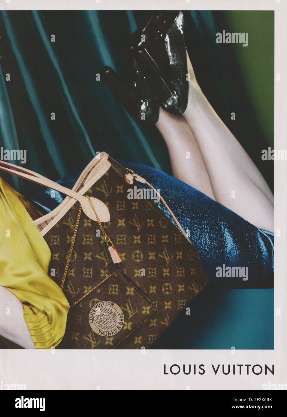 poster advertising Louis Vuitton handbag with Diane Krueger actress in  paper magazine from 2004, advertisement, creative advert from 2000s Stock  Photo - Alamy