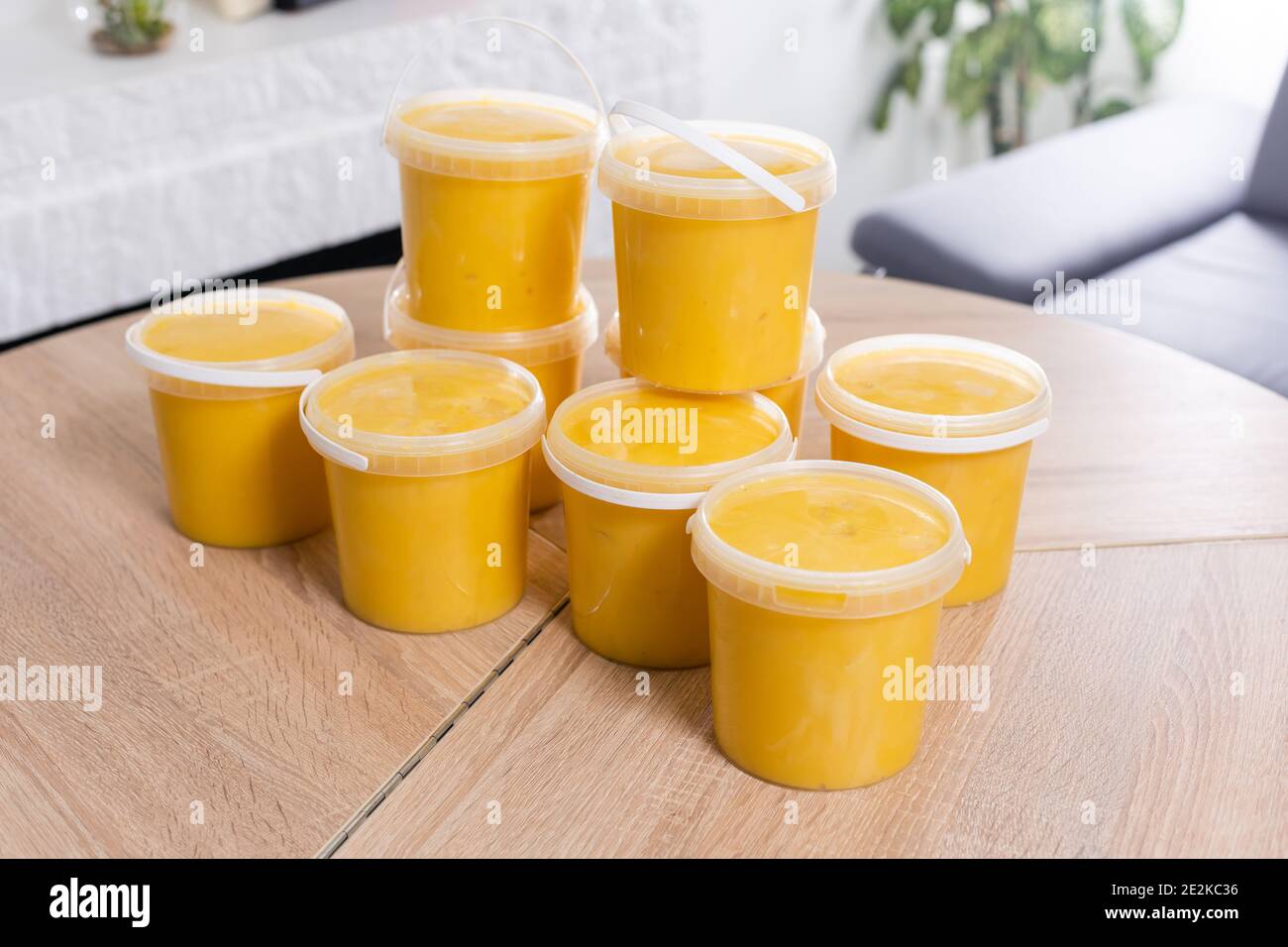 plastic containers with honey, plastic jars for honey Stock Photo Alamy