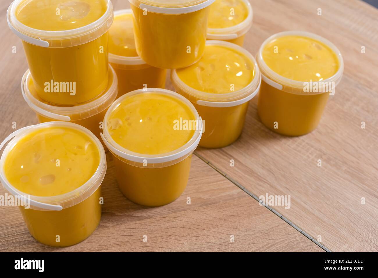 plastic containers with honey, plastic jars for honey Stock Photo Alamy