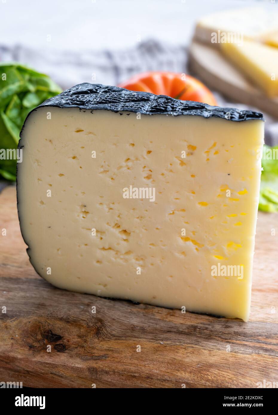 Cheese collection, French fol epi cheese with many little holes, etorki,  tomme noire des pyrenees and ossau iraty cheeses close up Stock Photo -  Alamy