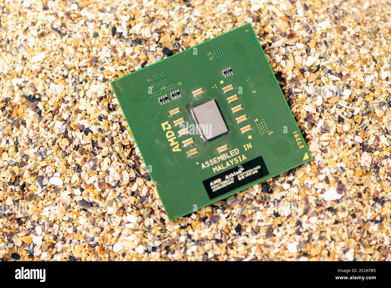Timisoara, Romania - October 18, 2020: Close-up of an AMD Athlon XP AXDA1700DUT3C processor, 1700 MHz, socket A with sand in the background. Stock Photo