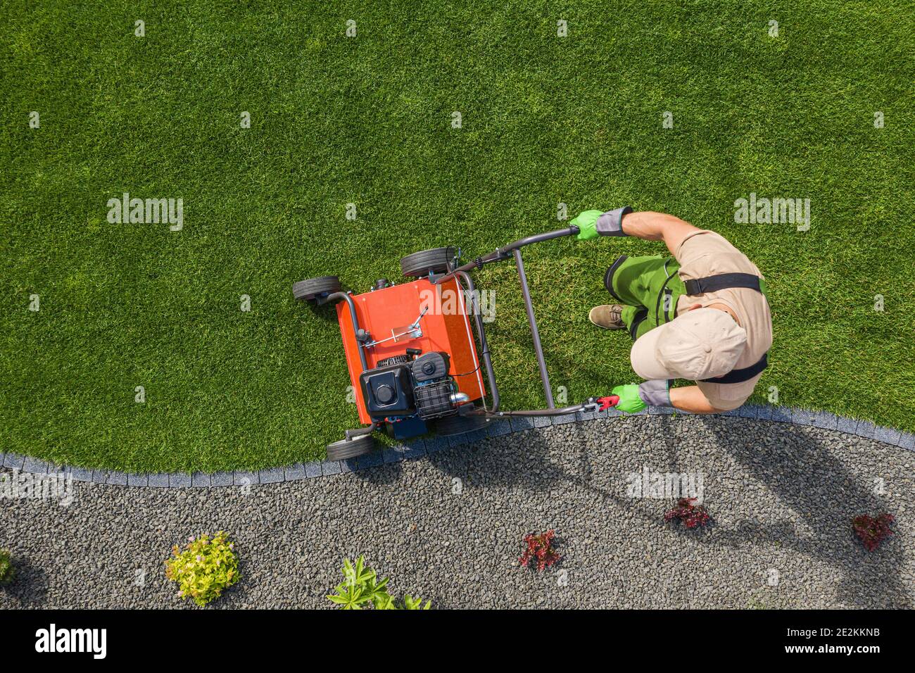 Backyard Garden Lawn Aeration Job Aerial View For Controlling Lawn Thatch and Soil Compaction. Gardening and Landscaping Industry Theme. Stock Photo