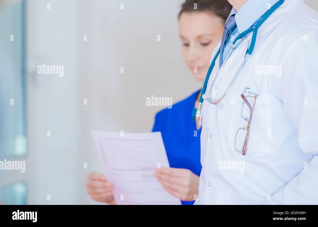 Healthcare Professionals Theme. Medical Personel Inside Hospital Hallway Close Up. Stock Photo