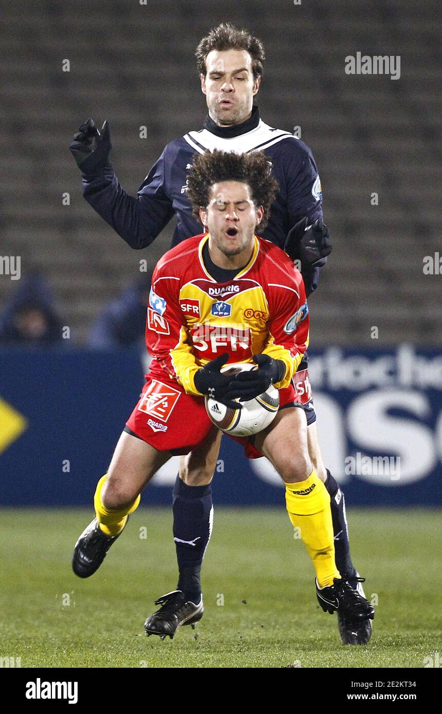 Bordeaux's Franck Jurietti fights for the ball with Rodez Aveyron's player  during The Coupe de France soccer match, Bordeaux vs Rodez Aveyron at  Chaban-Delmas Stadium in Bordeaux, France on January 9, 2010.