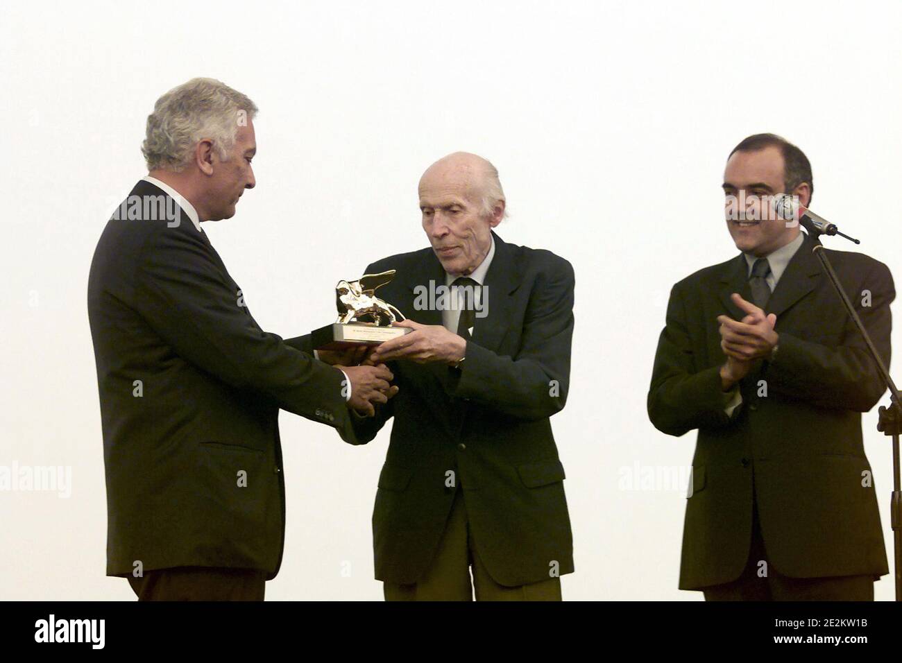 French film director Eric Rohmer holds the golden Lion Career achievement award received from Biennale director Paolo Baratta during the 58th Venice film festival, Italy, on September 7, 2001. Photo by ABACAPRESS.COM Stock Photo