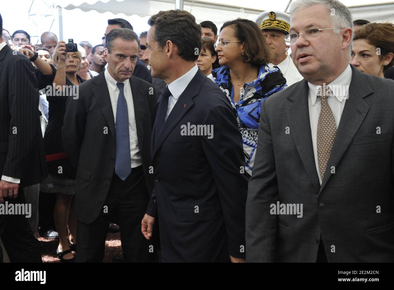 French President Nicolas Sarkozy (C) alongside President of French energy giant EDF (Electricite de France) Henri Proglio (L) tours the AKUO photovoltaic site in Saint-Pierre, French overseas department La Reunion, on January 19, 2010, during his official two-day trip to the Indian Ocean. Photo by Elodie Gregoire/ABACAPRESS.COM Stock Photo