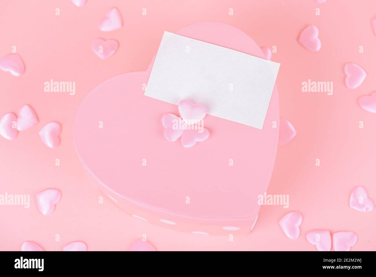 Pink heart shape gift box with card on a pink backround, Celebration ...