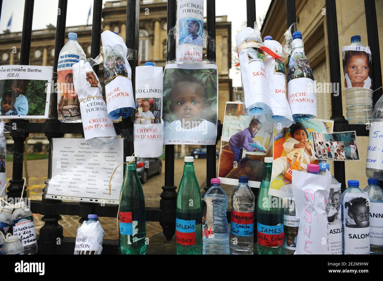 Water bottles placed bearing the photos and the names of Haitian orphans, during an action of French action group 'Collectif SOS Haiti Enfants Adoptes', or 'Haiti Adopted Children Emergency Action Group', in front of the French Foreign Ministry in Paris, Saturday, January 23, 2010. The group is asking for the immediate repatriation of all Haitian orphans whose adoption case is in process. Photo by Mousse/ABACAPRESS.COM Stock Photo