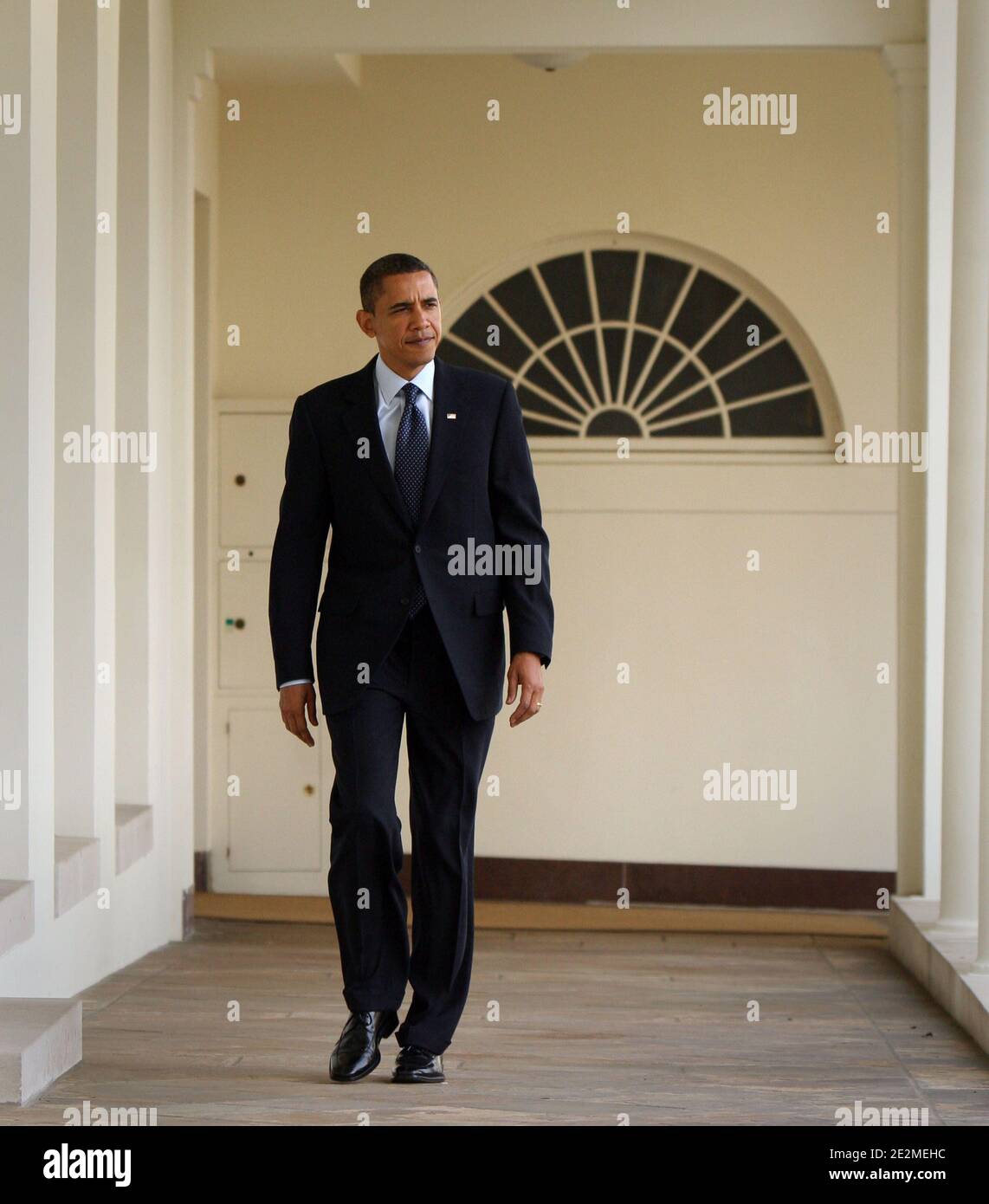 US President Barack Obama walks along the colonnade of The White House to the Oval Office in Washington, DC, USA on January 27, 2010. Later this evening, while facing declining popularity among the American people, Obama will give his first State of The Union address in which he is expected to call for, among other things, tax cuts for the middle class and a three year freeze on discretionary spending. Photo by Chris Kleponis/ABACAPRESS.COM (Pictured: Barack Obama) Stock Photo