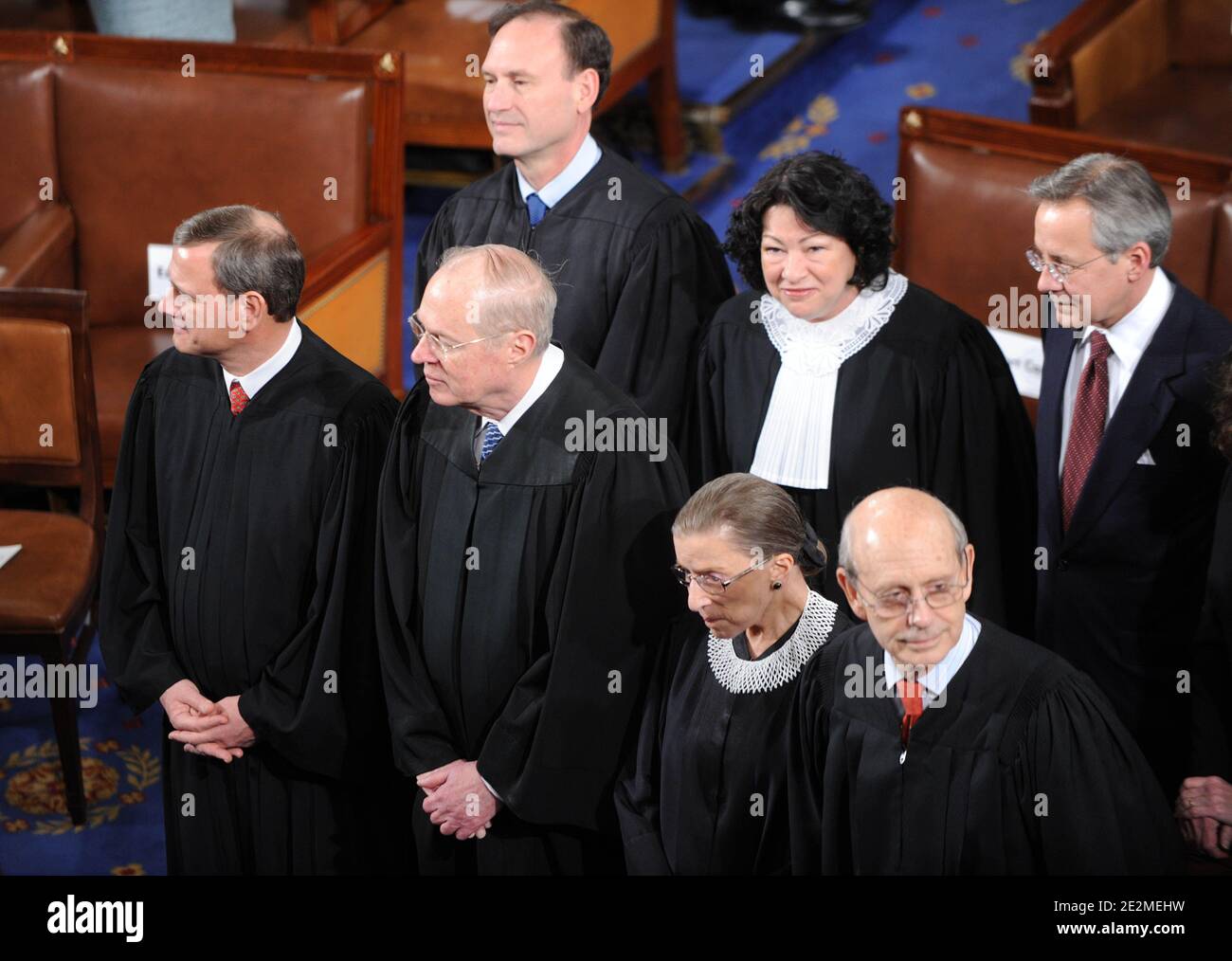 The Supreme Court Justices wait for President Barack Obama to give