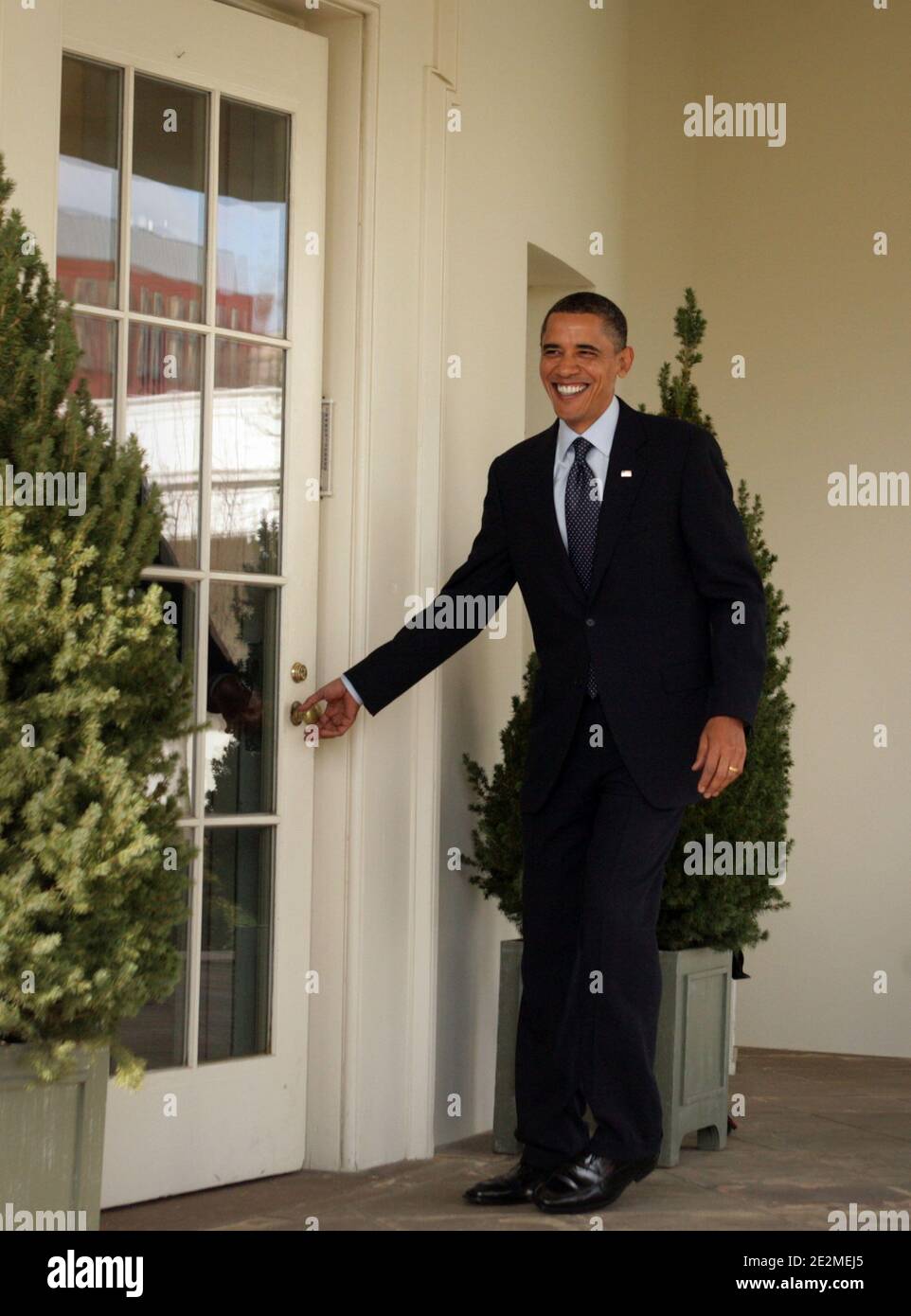 US President Barack Obama walks along the colonnade of The White House to the Oval Office in Washington, DC, USA on January 27, 2010. Later this evening, while facing declining popularity among the American people, Obama will give his first State of The Union address in which he is expected to call for, among other things, tax cuts for the middle class and a three year freeze on discretionary spending. Photo by Chris Kleponis/ABACAPRESS.COM (Pictured: Barack Obama) Stock Photo