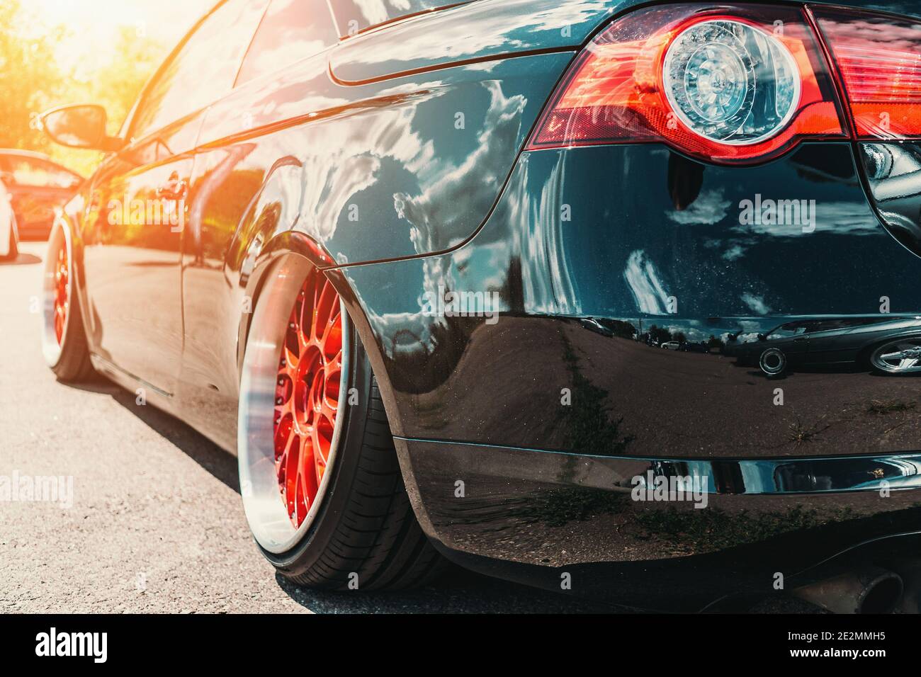 Tuned sport car with custom wheel and low profile like lowrider style. Stock Photo