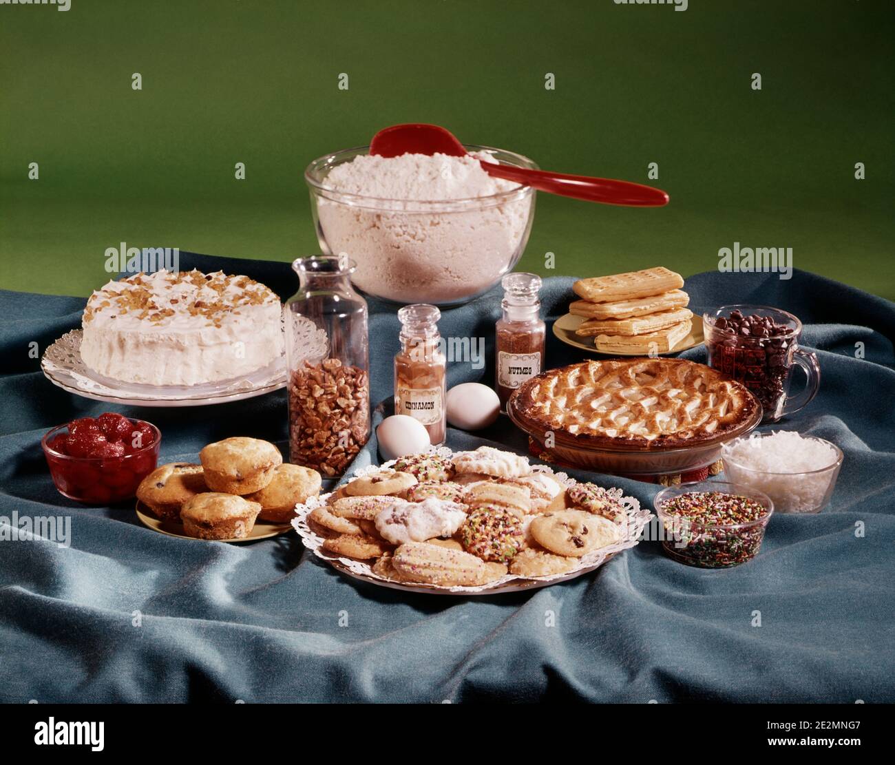 1980s ASSORTED PASTRIES COOKIES PIES MUFFINS BAKING SPICES DESSERTS - kf19138 DAS001 HARS OLD FASHIONED Stock Photo