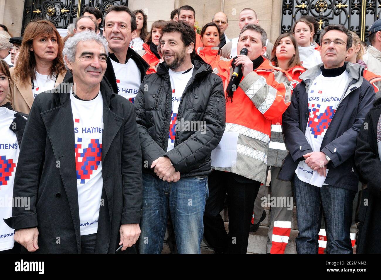 L-R) France's National soccer team coach Raymond Domenech, Jean-Luc  Reichmann, Patrick Bruel and Neuilly-sur-Seine mayor Jean-Christophe  Fromantin participate in a meeting hosted by the French Red Cross for Haiti  ,'Marchons pour Haiti,