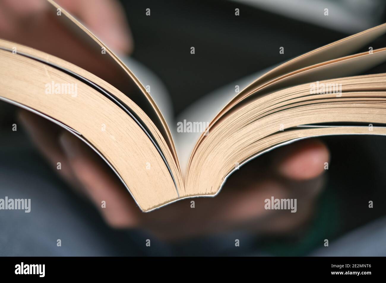 Man close up while reading book in leisure time,knowledge study in lock down,home relax lifestyle Stock Photo