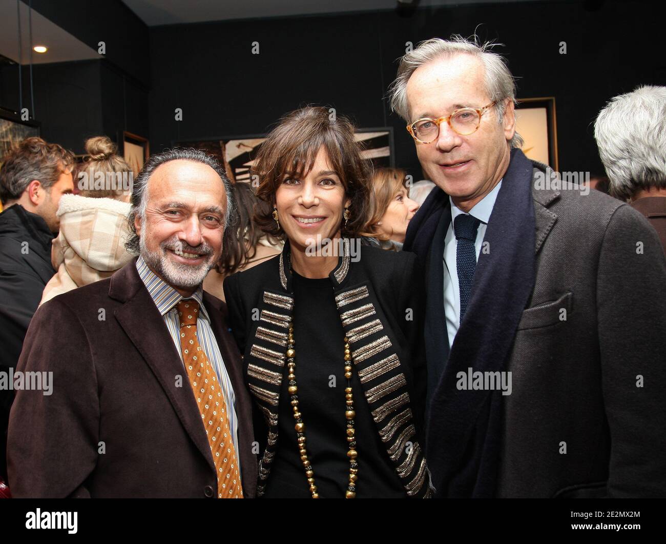 'Olivier Dassault, Christine Orban and Olivier Orban during the exhibition of Michele Morgan's and Olivier Dassault's paintings at the Galerie ''Artiste en Lumiere'' in Paris, France on February 12, 2010. Photo by Marco Vitchi/ABACAPRESS.COM' Stock Photo