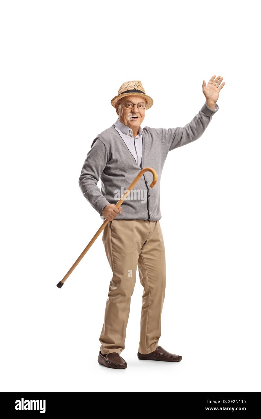 Elderly man holding a cane and waving isolated on white background ...
