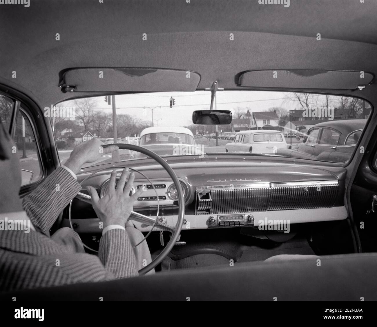 1950s BACK VIEW IMPATIENT MAN DRIVING HONKING HORN ON STEERING WHEEL