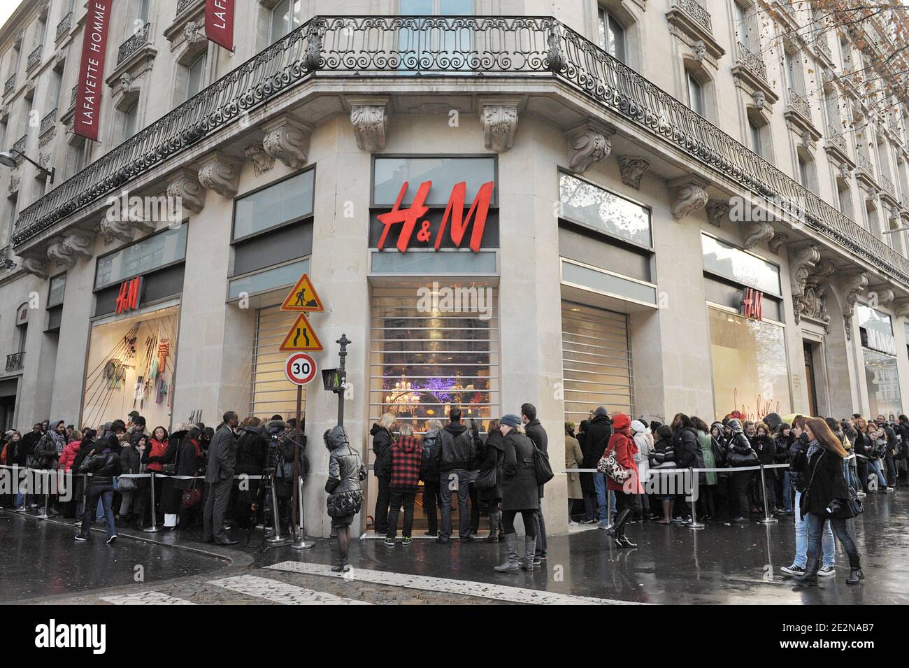 People rush to get clothes in a H&M store stocking the new collection  designed by French designer Sonia Rykiel for H&M. Rykiel's line for H&M,  launched today in several stores, starts at