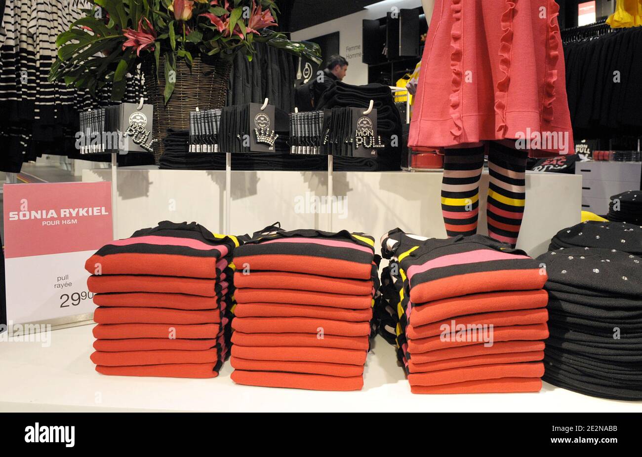 People rush to get clothes in a H&M store stocking the new collection  designed by French designer Sonia Rykiel for H&M. Rykiel's line for H&M,  launched today in several stores, starts at