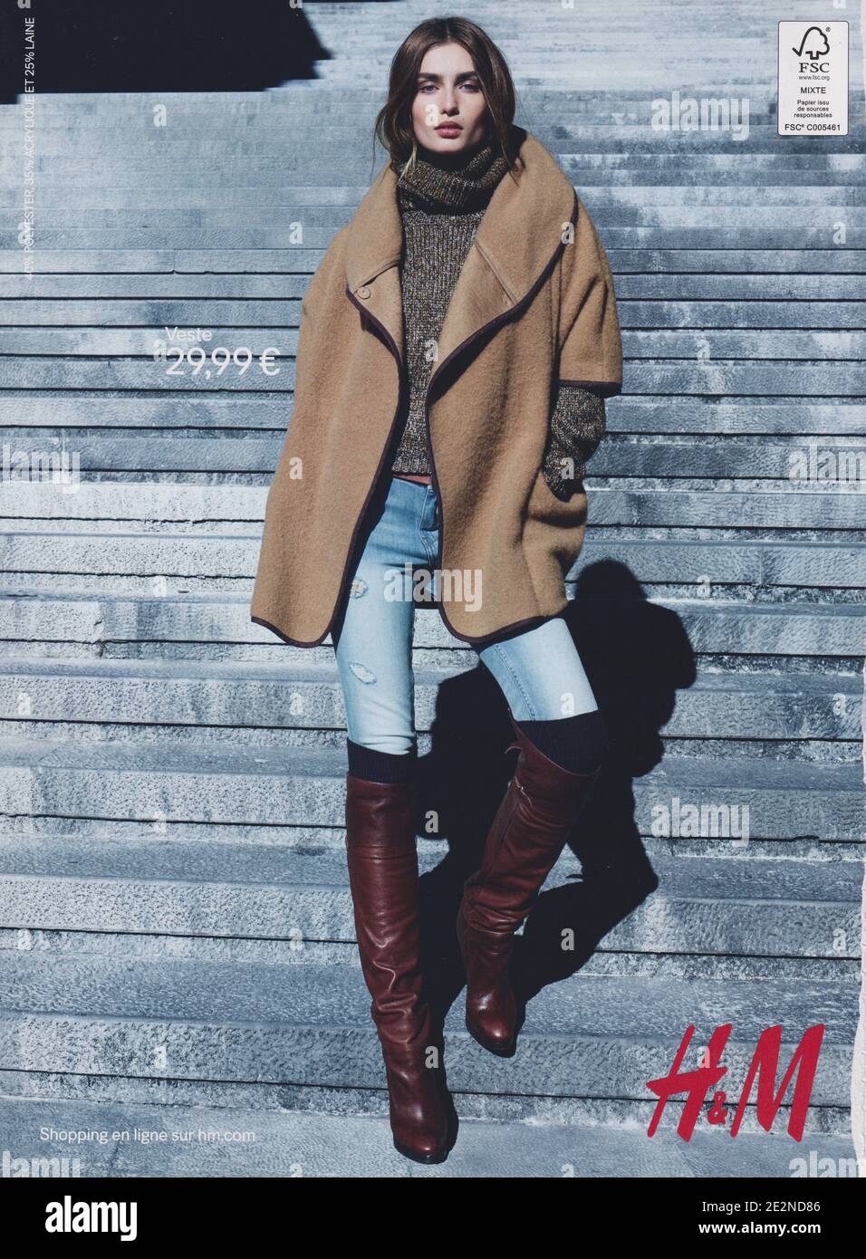 poster advertising H M fashion house with Andreea Diaconu in paper