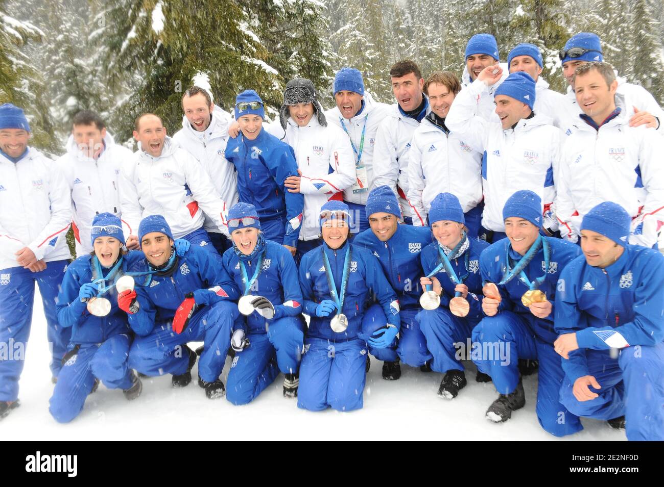France's Biathlon team and coaches pose with their medals after the last Biathlon competition for the Vancouver 2010 XXI Olympic Winter Games at Olympic Park in Whistler, Canada on February 26, 2010. Photo by Gouhier-Hahn-Nebinger/ABACAPRESS.COM Stock Photo