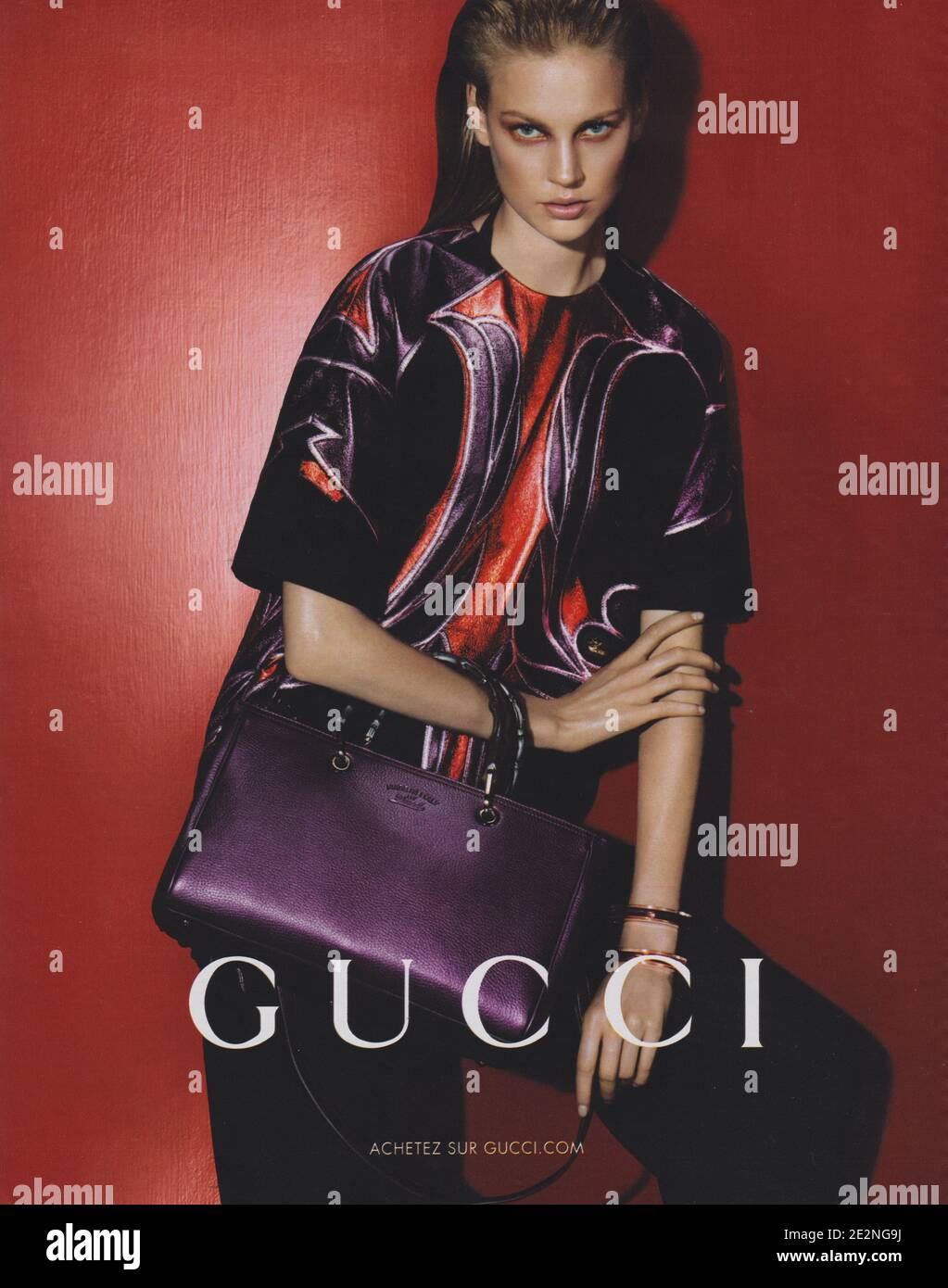 poster advertising GUCCI fashion house with Elisabeth Erm in paper magazine  from 2014 year, advertisement, creative GUCCI advert from 2010s Stock Photo  - Alamy