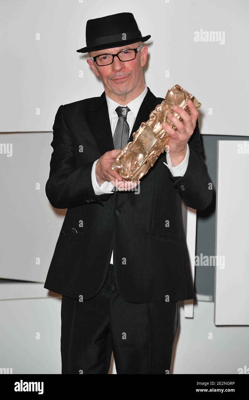 Jacques Audiard poses at a photocall during the 35th Cesar Film Awards