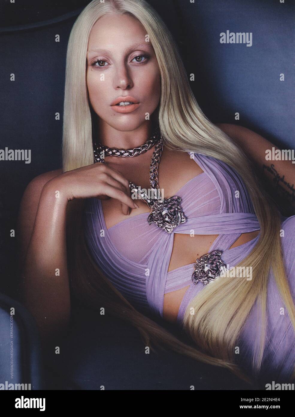 poster advertising VERSACE fashion house with Lady Gaga in paper magazine from 2014 year, advertisement, creative VERSACE advert from 2010s Stock Photo