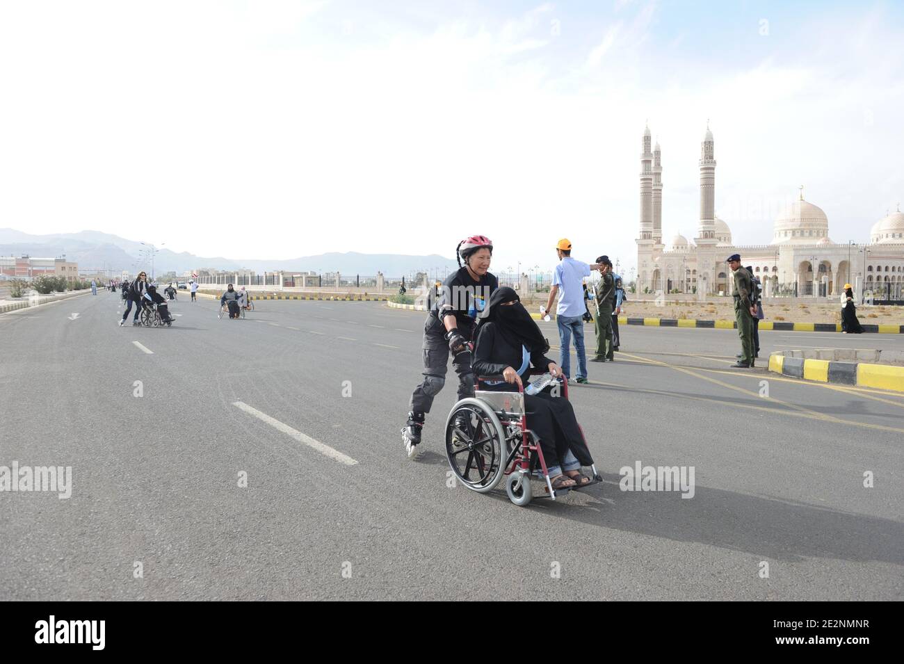 French rollerbladers seen skating with Yemenite disabled people, in a rallye around the 'Al-Saleh' mosque in Sana'a, Yemen, on February 28, 2010. Yemen is seen as a 'dangerous' country, with terrorism threat for westerners. The event was meant to draw attention to Yemenite disabled special needs, and ask for laws to support them. Photo by Ammar Abd Rabbo/ABACAPRESS.COM Stock Photo