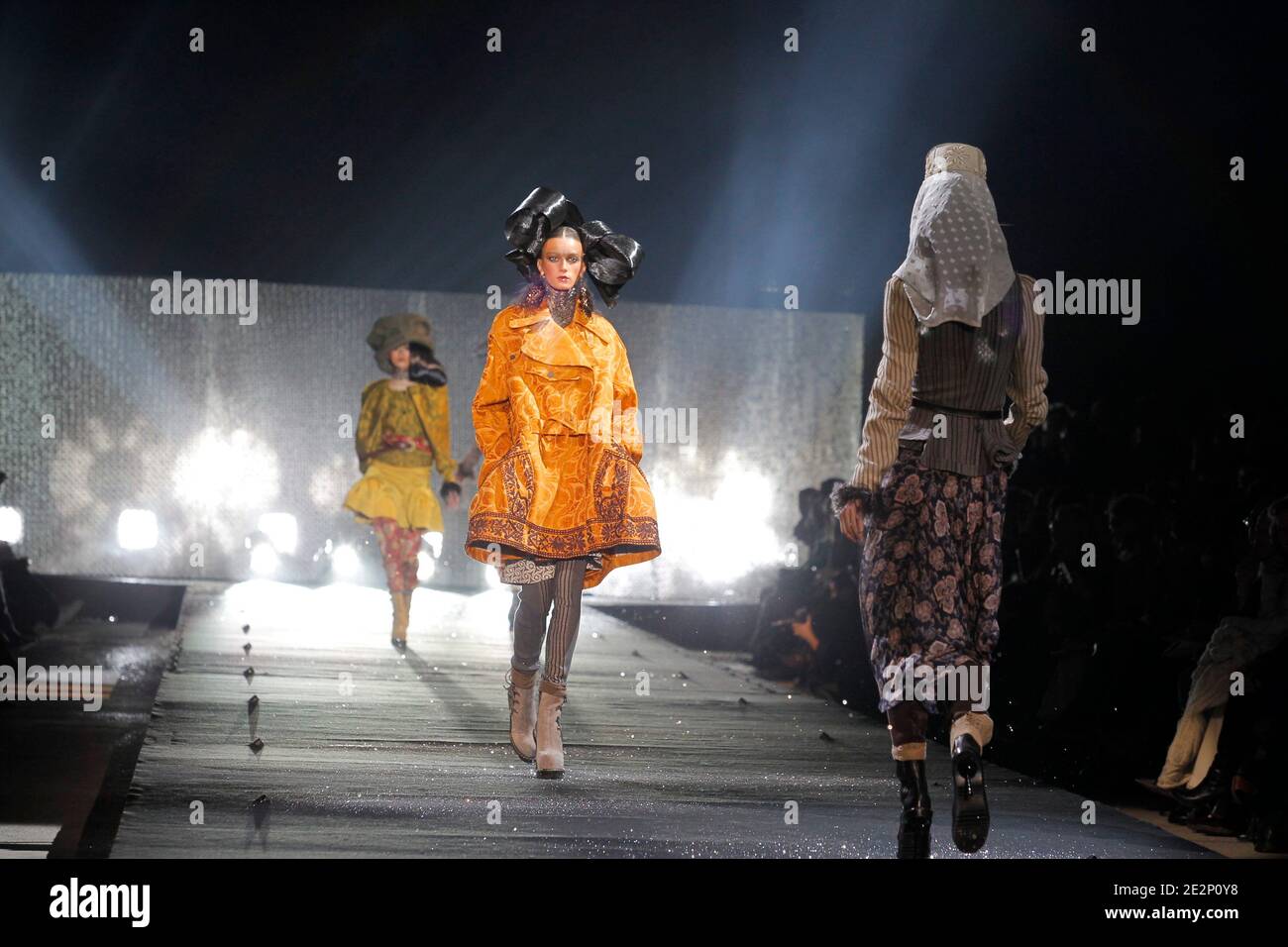 John Galliano Paris Ready to Wear Autumn Winter Back of model finger waved  hair, wearing fluffy beret hat and Italian newspaper Stock Photo - Alamy