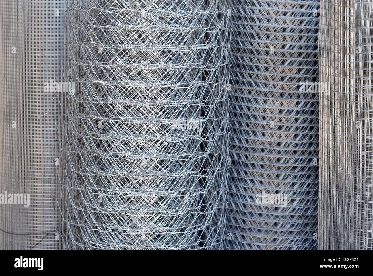 roll of metallic net. Rolls of metal wire fence different heights Stock Photo Alamy