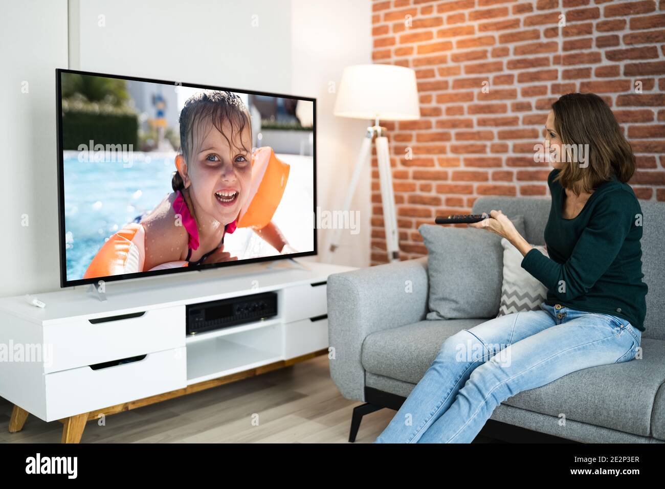 Watching movie sofa hires stock photography and images Alamy