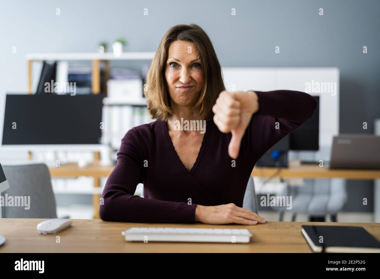 Woman Portrait Showing Dislike Thumbs Down Negative Feedback Stock Photo