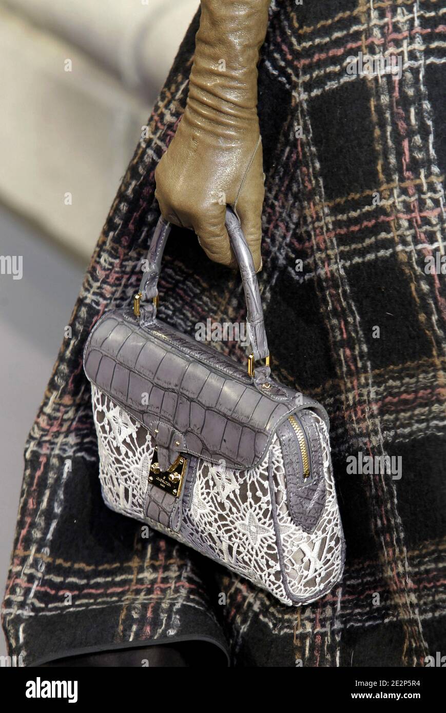A model holds a handbag designed by Marc Jacobs for Louis Vuitton  Fall-Winter 2010/2011 Ready-to-Wear collection show held at the Cour Carre  du Louvre in Paris, France on March 10, 2010. Photo