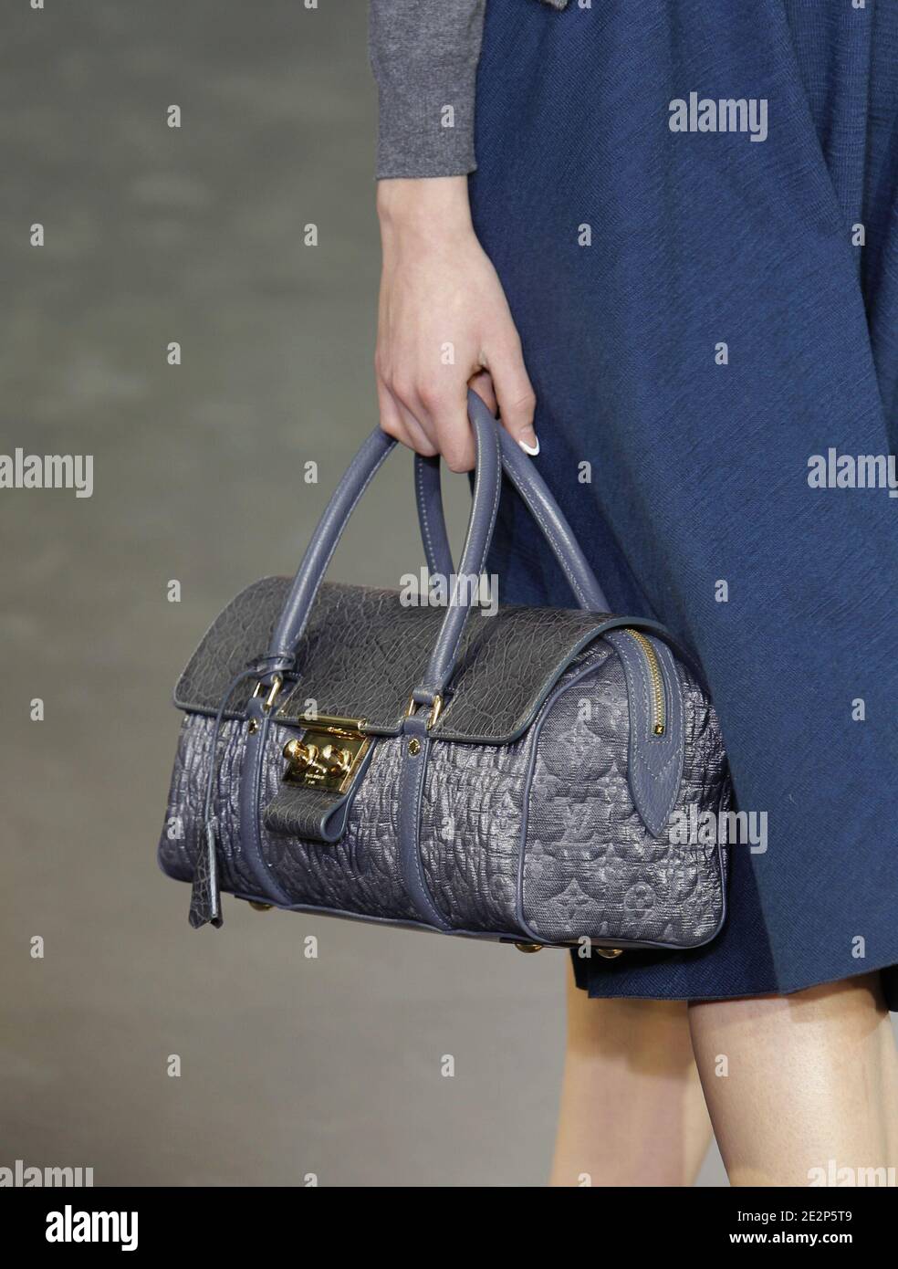 A model holds a handbag designed by Marc Jacobs for Louis Vuitton  Fall-Winter 2010/2011 Ready-to-Wear collection show held at the Cour Carre  du Louvre in Paris, France on March 10, 2010. Photo