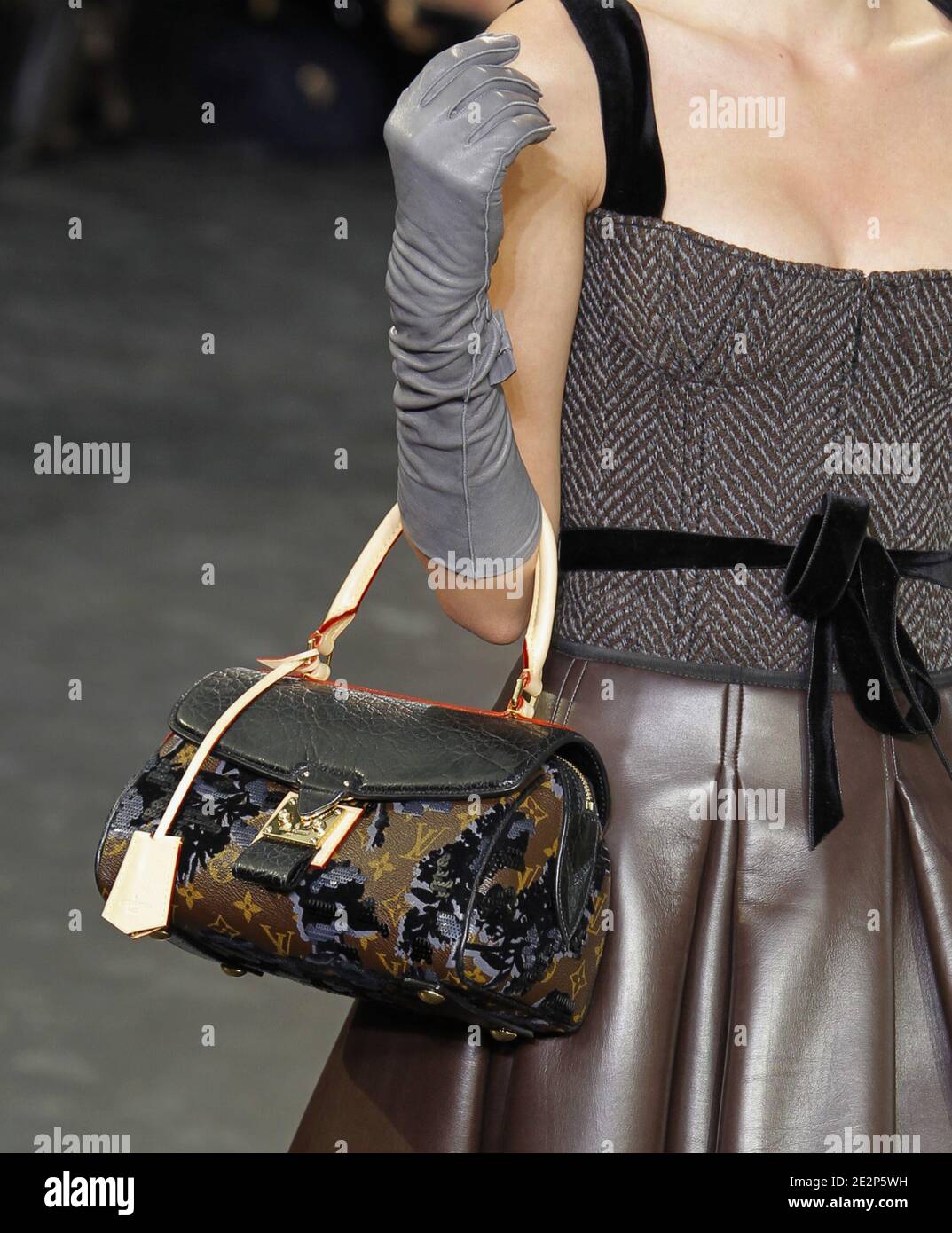 A model holds a handbag designed by Marc Jacobs for Louis Vuitton