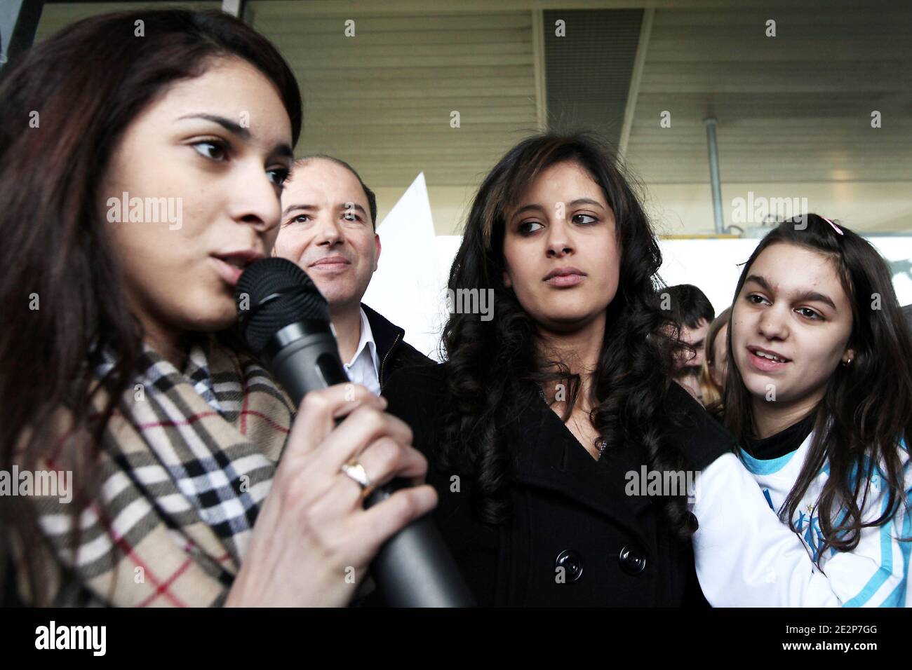 Najlae Lhimer a Moroccan high school student recently expelled from France as an illegal immigrant is welcomed upon her arrival at Orly airport, in Paris, France, from Casablanca, on March 13, 2010. Najlae, who was arrested last February after pressing charges of violence against her brother and expelled to Morocco as illegall immigrant, was authorized this week to return to France by French President Nicolas Sarkozy. Photo by Stephane Lemouton/ABACAPRESS.COM Stock Photo