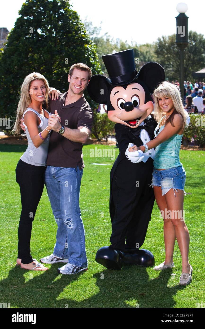 'Jake Pavelka (left), star of ABC's ''The Bachelor,'' strikes a dance pose March 13, 2010 with his fiancee, Vienna Girardi (second from left) while Mickey Mouse poses with professional dancer Chelsie Hightower (right), star of ABC's ''Dancing with the Stars,'' at the Magic Kingdom in Lake Buena Vista, Fla. Pavelka and Hightower are partners on the new season of ''Dancing with the Stars'' which premieres March 22, 2010. Pavelka, Girardi and Hightower were vacationing this weekend at Walt Disney World Resort. Photo By Matt Stroshane/Disney via ABACAPRESS.COM (Pictured: Jake Pavelka, Vienna Girar Stock Photo
