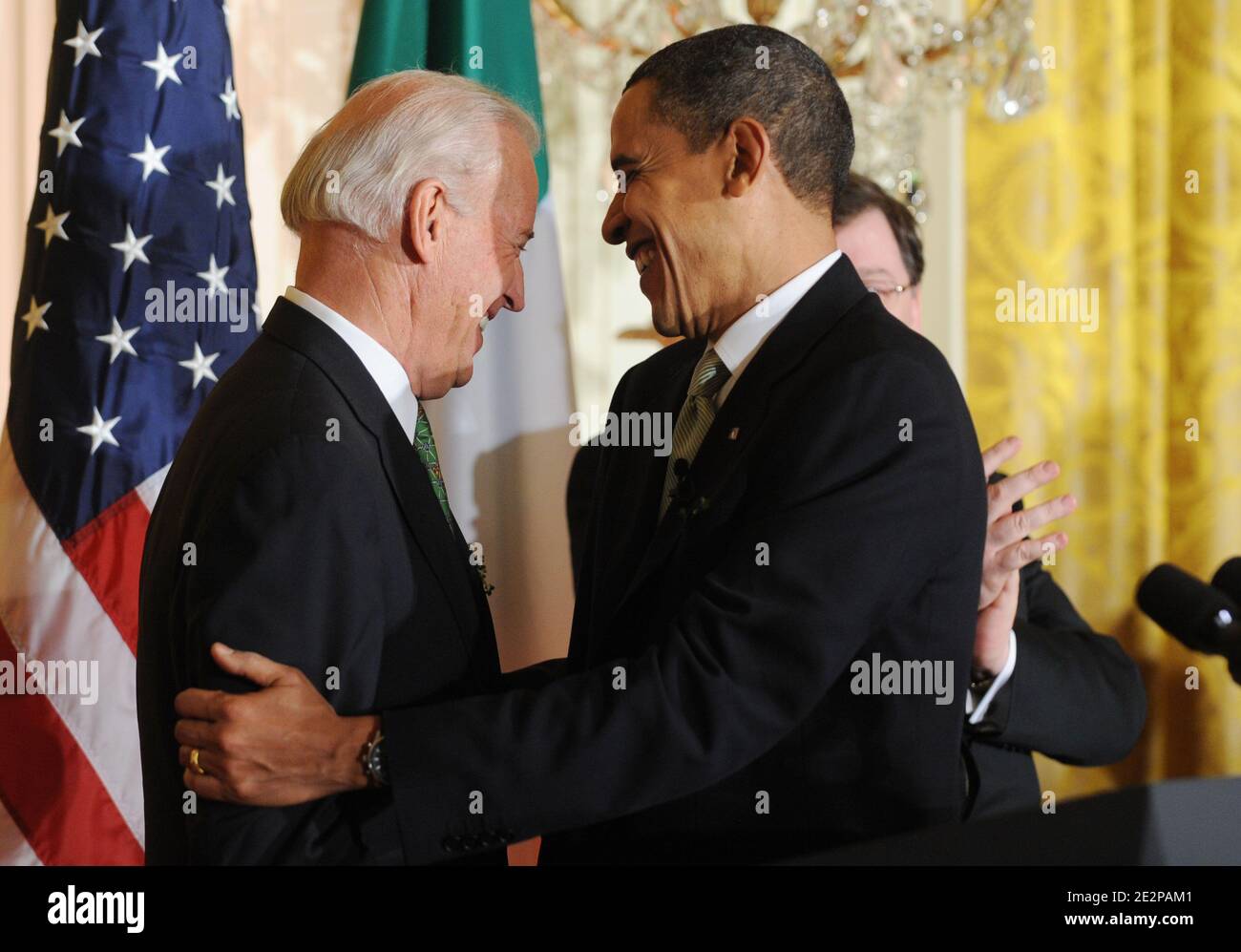 US President Barack Obama (R) and US Vice President Joe Biden (L) greet one another beside the podium during the annual St. Patrick's Day Reception in the East Room of the White House, in Washington DC, USA, on March 17, 2010. President Obama and the Prime Minister (Taoiseach) of Ireland Brian Cowen delivered remarks and participated in a traditional Shamrock ceremony. Photo by Michael Reynolds/Pool/ABACAPRESS.COM Stock Photo