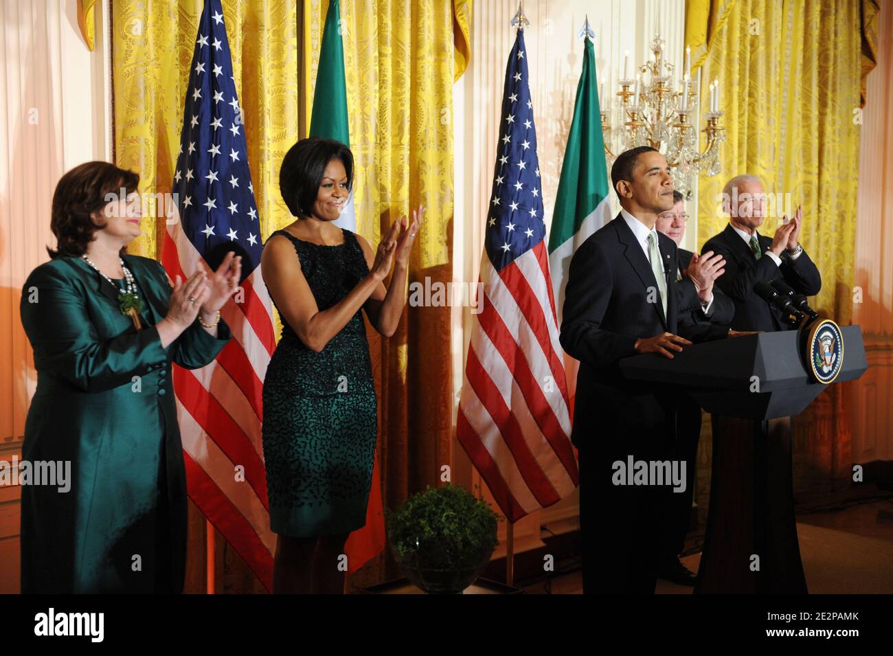 US President Barack Obama (C) delivers remarks as US Vice President Joe Biden (R), Prime Minister (Taoiseach) of Ireland Brian Cowen (2-R), US First Lady Michelle Obama (2-L) and wife of the Taoiseach Mary Cowen (L) look on during the annual St. Patrick's Day Reception in the East Room of the White House, in Washington DC, USA, on March 17, 2010. President Obama and the Prime Minister (Taoiseach) of Ireland Brian Cowen delivered remarks and participated in a traditional Shamrock ceremony. Photo by Michael Reynolds/Pool/ABACAPRESS.COM Stock Photo