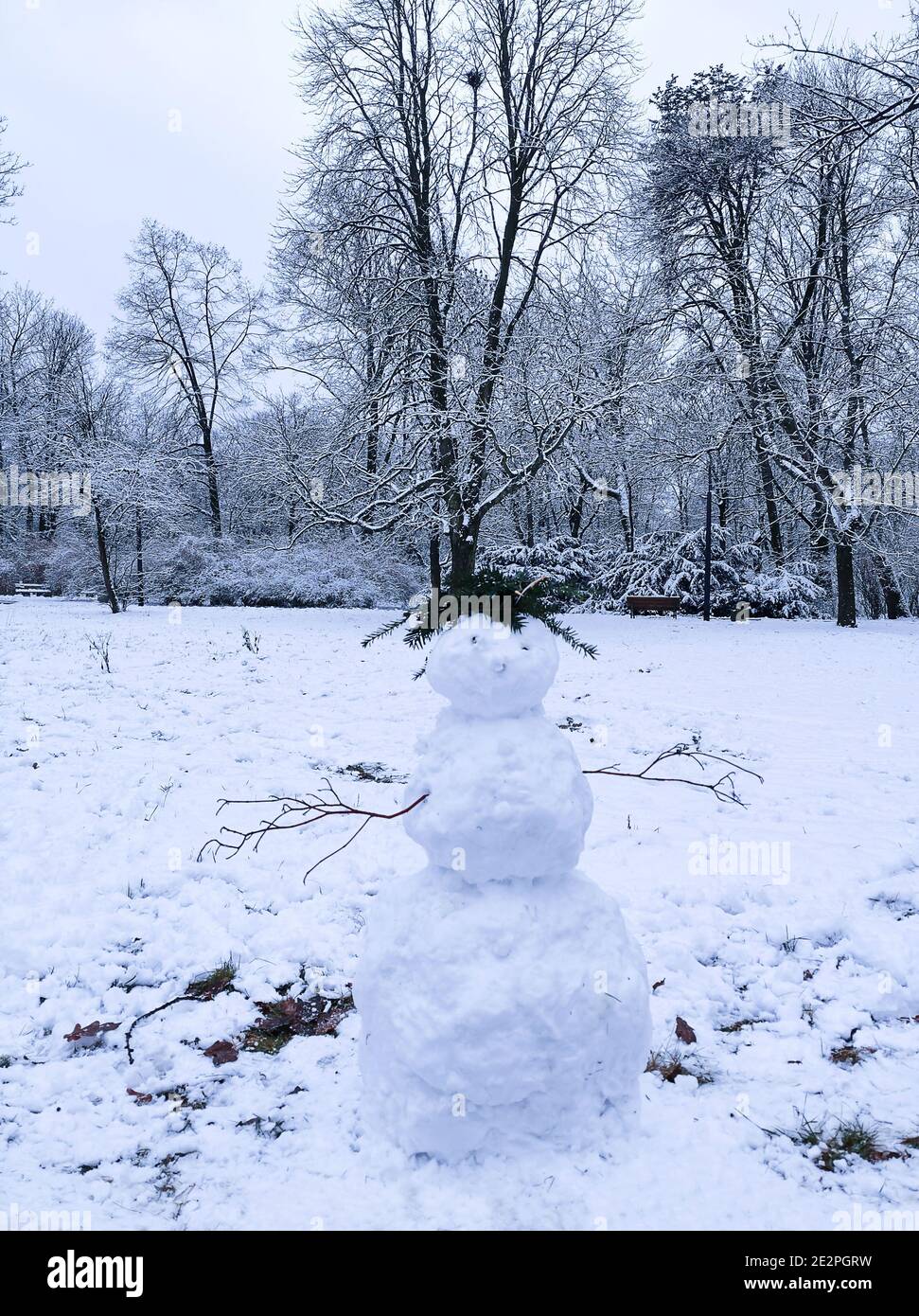 Funny snowman standing in the snow on a frosty winter day Stock Photo