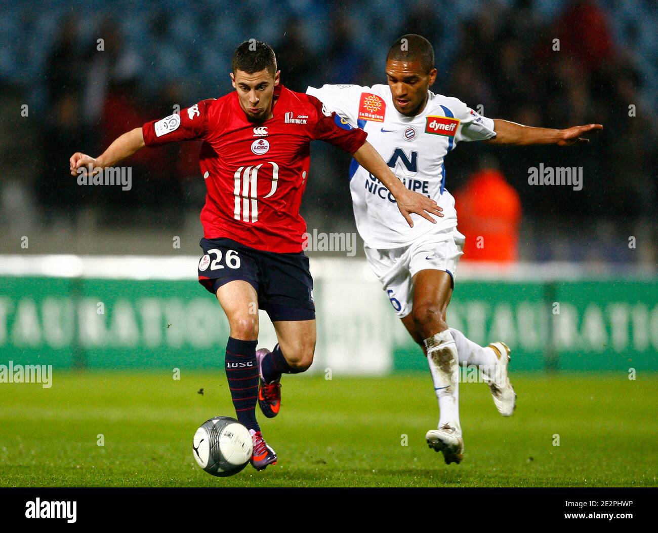 Lille's Eden Hazard fights for the ball with Montpellier's Joris Marveaux  during the French First League Soccer match, Lille OSC vs Montpellier HSC  at Lille Metropole Stadium in Lille, north of France