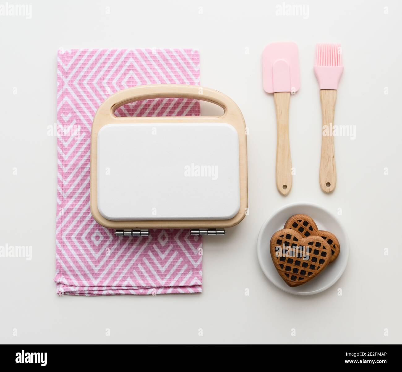 Stylish wooden play kitchen utensils. Wooden waffle maker, waffles