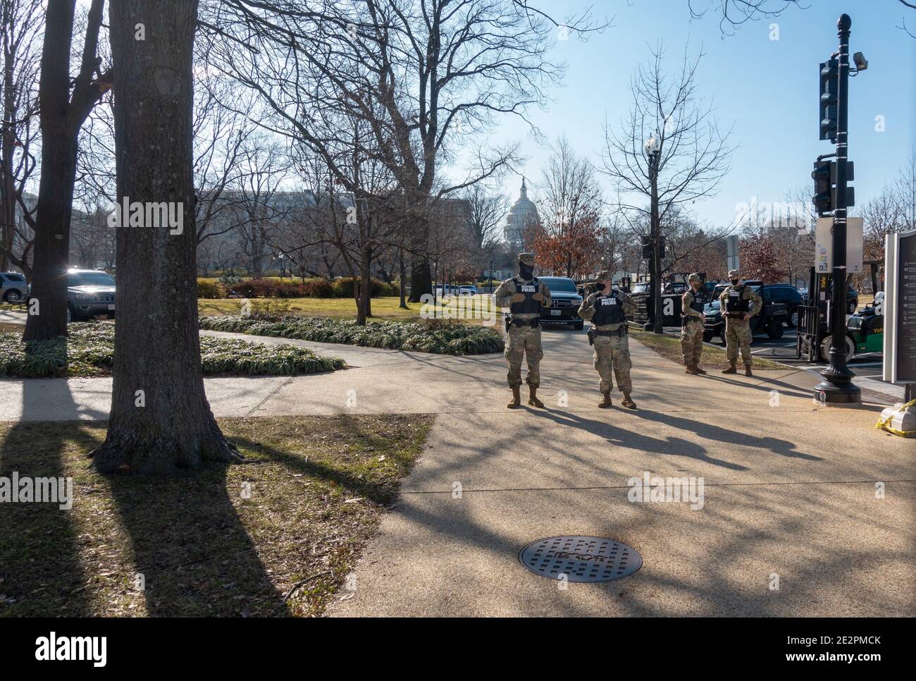 WASHINGTON, DC - JAN. 14, 2021: Two National Guard MPs stand watch at the U.S. Capitol as part of a show of force in preparation for anticipated pro-Trump extremist demonstrations and clashes, and Joe Biden's upcoming inauguration. Stock Photo